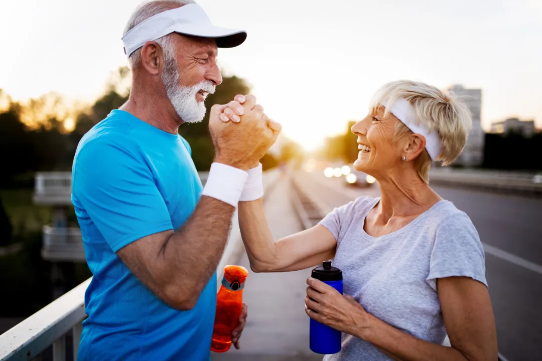 Active senior couple engaging in healthy sports activities as they work on Epigenetics, Terrain Theory, peptides, wellness and bone health.